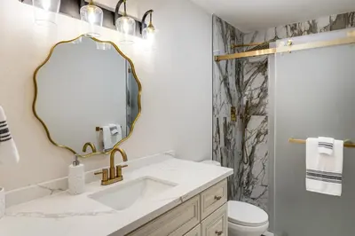 a bathroom with a sink and a mirror at Games Galore! Pine Mountain Club Retreat Near Town in Pine Mountain Club