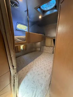 an inside view of a small room with a bed at Airstream at Tree Ranch Grove Paradise in Ojai