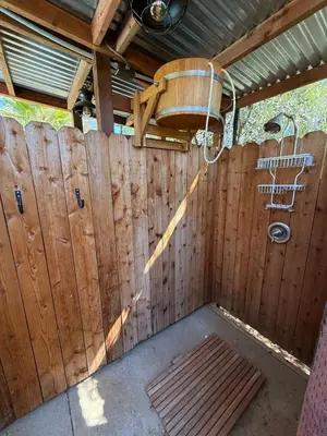 a wooden fence with a shower in a room at Airstream at Tree Ranch Grove Paradise in Ojai