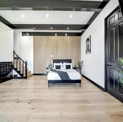 a bedroom with a bed and a staircase at Skyview Estate in Los Angeles