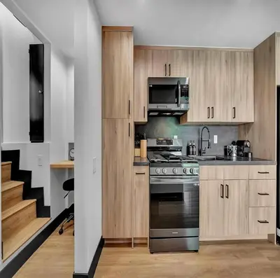 a kitchen with a stove and a microwave at Skyview Estate in Los Angeles