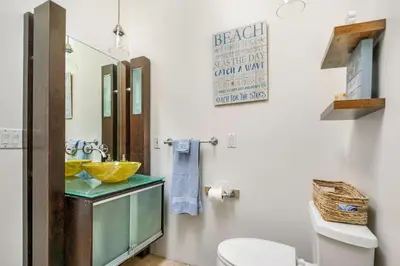 a bathroom with a sink and a toilet at 5 STAR BEAUTIFUL LONG BEACH HOuSE in Long Beach