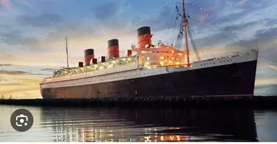 a cruise ship docked in the water at sunset at 5 STAR BEAUTIFUL LONG BEACH HOuSE in Long Beach