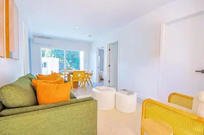 a living room with a couch and a table at Relaxing 4BR LA Home Private Pool & Fire Pit in Los Angeles