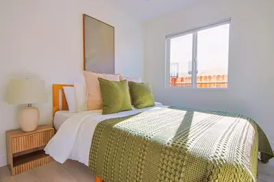 a bedroom with a bed and a window at Relaxing 4BR LA Home Private Pool & Fire Pit in Los Angeles