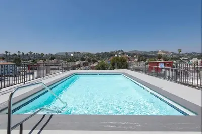 a swimming pool on top of a building at Polished 1BR Hollywood Apt w Rooftop Pool & Views in Los Angeles