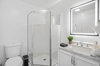 a bathroom with a shower and a toilet and a sink at Walk to Shoreline Village, BBQ in Prime Location in Long Beach