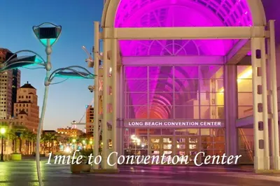 a building with a pink lightovation center at night at Walk to Shoreline Village, BBQ in Prime Location in Long Beach