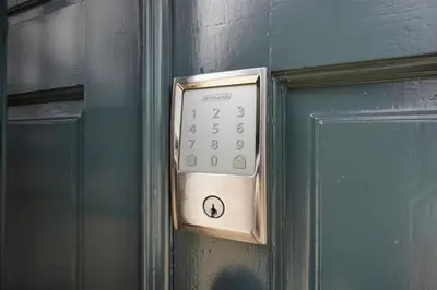 a door with a clock on the side of it at Walk to Shoreline Village, BBQ in Prime Location in Long Beach