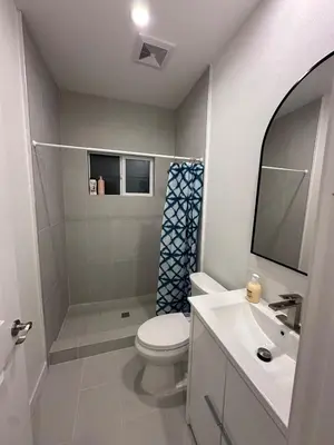a bathroom with a toilet and a sink at Brand New Muji Style 3B3B Retreat with Courtyard in Walnut
