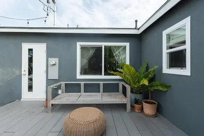 a porch with a bench and a window at Lovely Culver City Home 8 Mins to Beach Close to LAX in Los Angeles