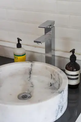 a white sink with two bottles of soap at Lovely Culver City Home 8 Mins to Beach Close to LAX in Los Angeles