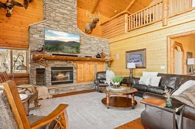 a living room with a fireplace in a cabin at Hawk Ridge Chalet In Big Bear Lake in Big Bear Lake