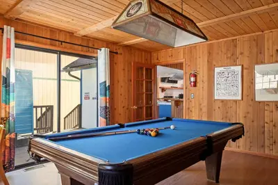 a pool table in a room with a ceiling at Solstice Shores Chalet, Hot Tub and Lake Views in Fawnskin