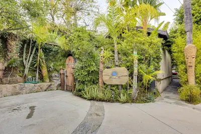 a house with a wooden door and plants at 2 Mi to Echo Park Funky Silver Lake Studio in Los Angeles