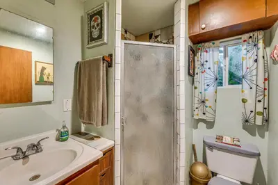 a bathroom with a shower and a sink and a toilet at 2 Mi to Echo Park Funky Silver Lake Studio in Los Angeles