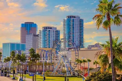 a city with a roller coaster in a park with tall buildings at Luxe 3BR South Bay - Comfort and Close to Beach in Harbor City