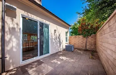 a house with a sliding glass door on a patio at Luxury 2 Bed 2 bath Home Near Six Flags in Santa Clarita