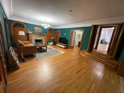 a living room with a couch and a fireplace at Hollywood Heritage Villa in Los Angeles