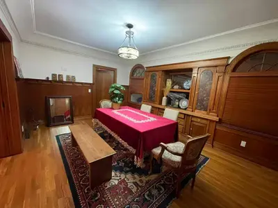 a dining room with a table with a red table cloth at Hollywood Heritage Villa in Los Angeles