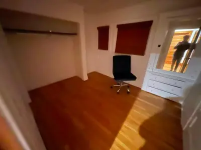 an empty room with a chair and a window at Hollywood Heritage Villa in Los Angeles