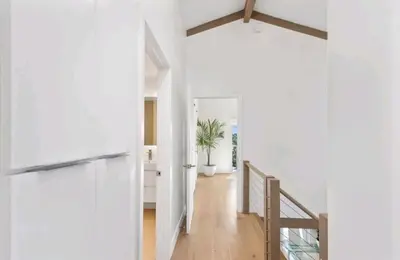a hallway of a house with a potted plant at Beautiful home with VIEWS in Silver Lake Hills in Los Angeles