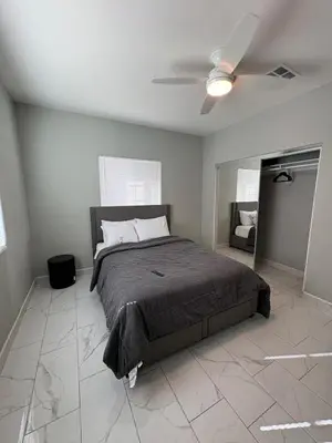 a bedroom with a bed and a ceiling fan at Welcome to A new updated 3 bedroom 2 Bath Home in California City