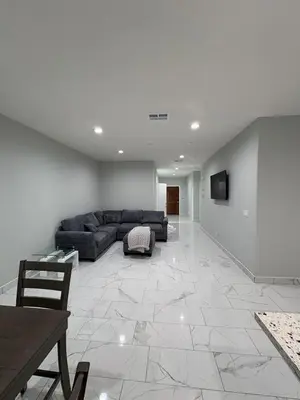a large living room with a couch and a television at Welcome to A new updated 3 bedroom 2 Bath Home in California City