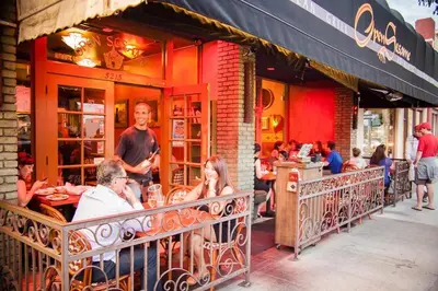 a group of people sitting outside of a restaurant at Steps to the Beach - Games - Free Parking in Long Beach