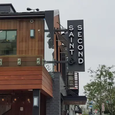a building with a sign on the side of it at Steps to Beach - Beach Essentials Provided! in Long Beach