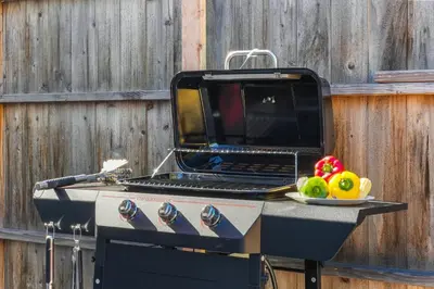 a grill with a laptop sitting on top of it at Belmont Shore Getaway with Hot Tub and Firepit in Long Beach