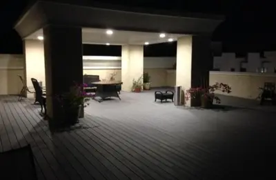 a large patio with chairs and a table in a building at Woodland Oasis 2BR With FREE PARKING in Canoga Park