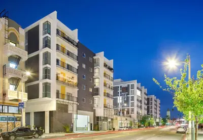 an apartment building on a city street at night at Luxe on Hollywood Blvd 2BR with FREE PARKING in Los Angeles