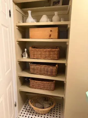 a pantry with baskets and wicker baskets on shelves at Hollywood Hills Duplex with view and parking! in Los Angeles
