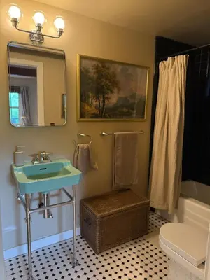 a bathroom with a sink and a mirror at Hollywood Hills Duplex with view and parking! in Los Angeles
