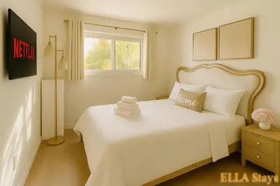 a white bedroom with a white bed and a window at Rowland Heights Cozy & Quiet Home in Rowland Heights