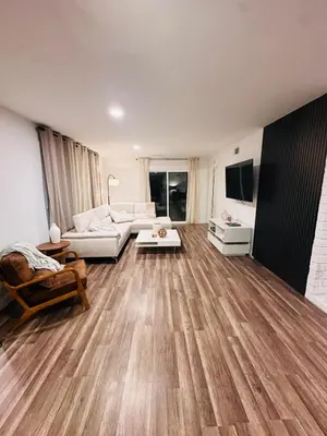 a living room with a couch and a table at Stunning Oasis with Pool by Disneyland and Knotts in Buena Park