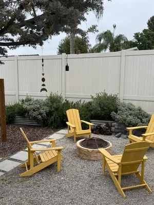 a group of chairs and a fire pit in a yard at NEW Cozy Studio City Guesthouse in Prime Location in Studio City