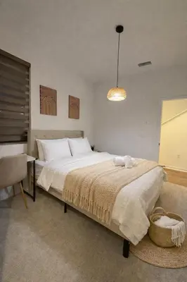 a bedroom with a large bed with a basket on it at 85 hotel in Eastvale