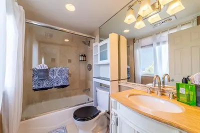 a bathroom with a sink and a toilet at Ocean View Penthouse 2 Bdrm 2 Bath w garage 2 Blocks to sand in Manhattan Beach