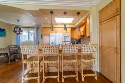 a kitchen with a table and some chairs at Ocean View Penthouse 2 Bdrm 2 Bath w garage 2 Blocks to sand in Manhattan Beach