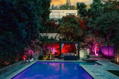a swimming pool with christmas lights in a yard at 2BR Luxury Villa in West Hollywood with Private Pool in Los Angeles
