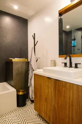 a bathroom with a sink and a mirror and a tub at 2BR Luxury Villa in West Hollywood with Private Pool in Los Angeles