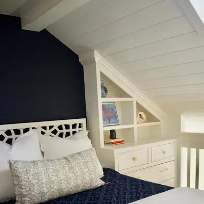 a bedroom with a bed with a white headboard at Exquisite Carpinteria Beach Cottage, Steps Away From The Beach in Carpinteria