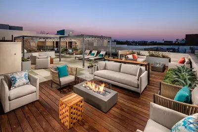 a rooftop patio with couches and a fire pit at Cozy 2B Apartment in Santa Monica in Los Angeles