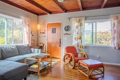 a living room with a couch and a table at Venice Beach House with beautiful private yard in Los Angeles
