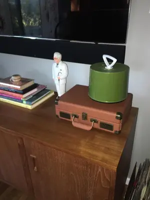 a cake sitting on top of a dresser with a suitcase at Venice Beach House with beautiful private yard in Los Angeles