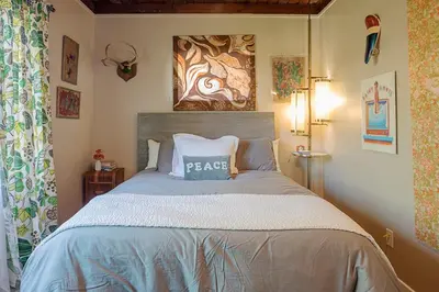 a bedroom with a bed with a pillow on it at Venice Beach House with beautiful private yard in Los Angeles