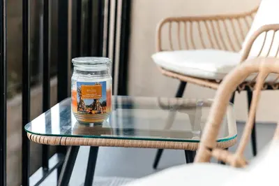 a glass table with a jar on top of it at Pacific Aura in Los Angeles