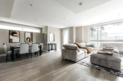 a living room with a couch and a table at West Hollywood Luxe Townhome Walkable WeHo Avalon in Los Angeles